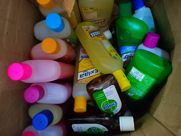 An assortment of household and personal-care supplies arranged together.