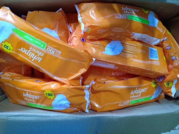Stacks of packaged personal-care supplies.